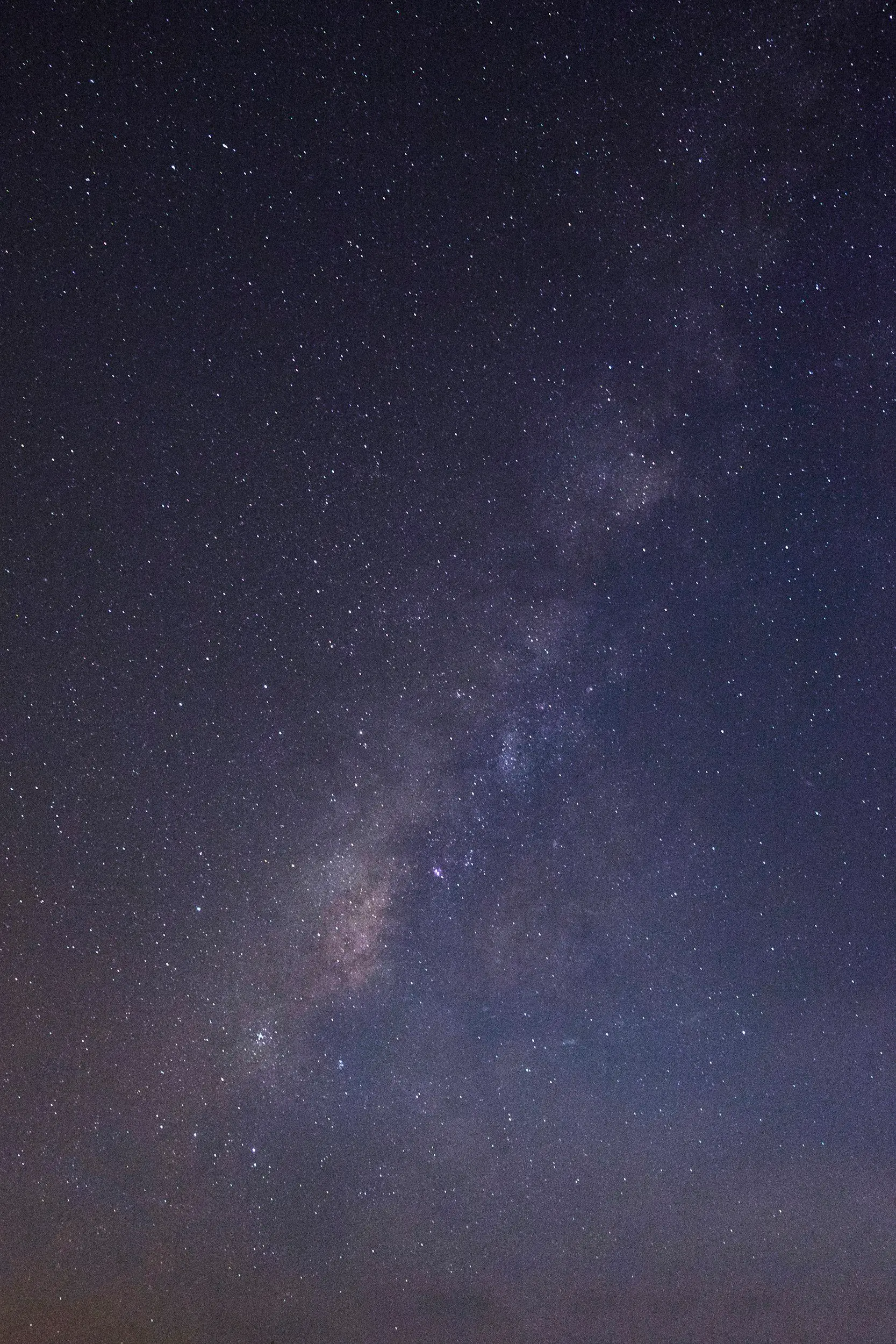 Night sky filled with stars and a faint view of the Milky Way