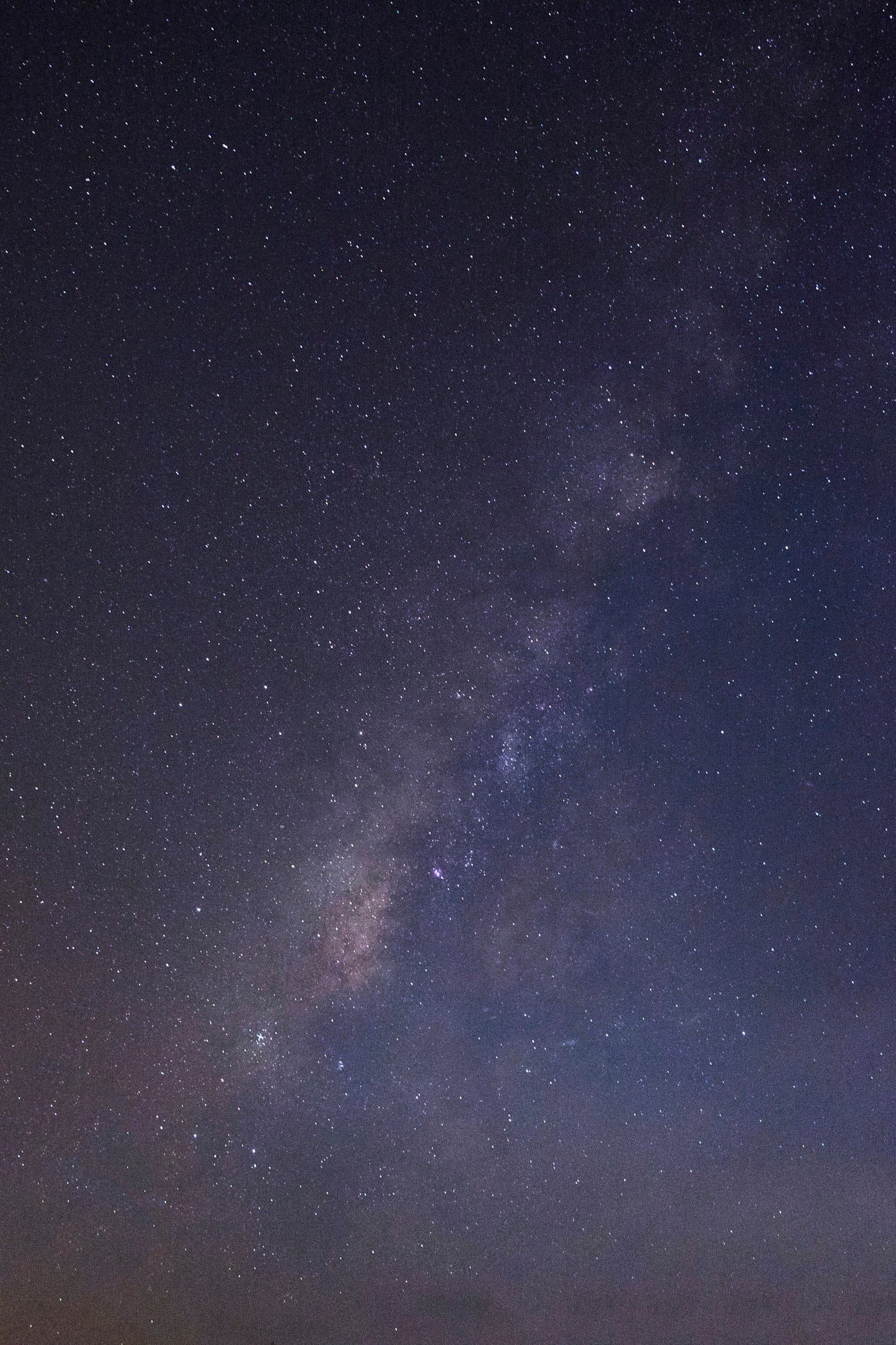 Night sky filled with stars and a faint view of the Milky Way